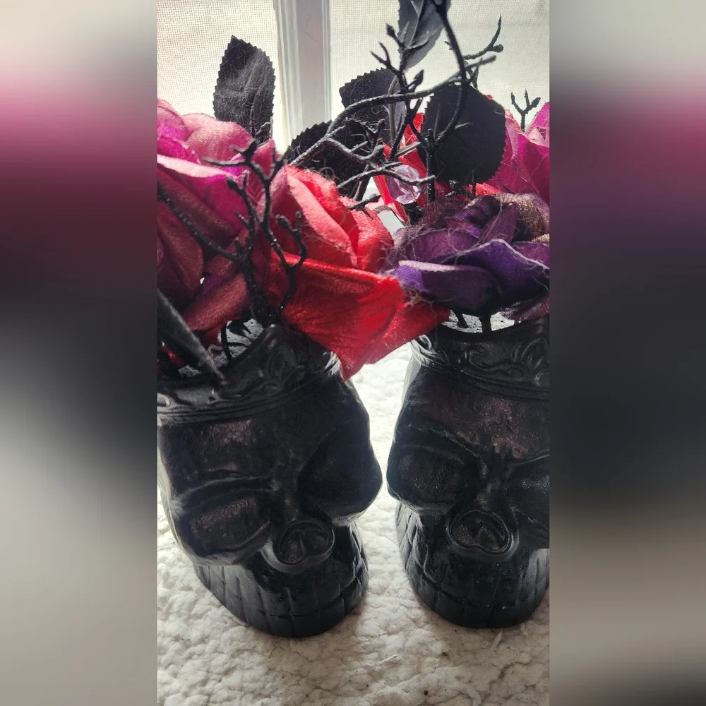 Black Skull Vases with Red and Purple Flowers